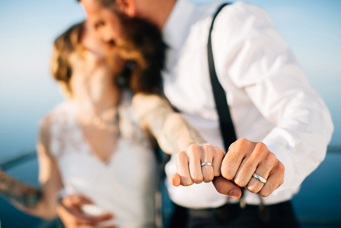 bride and groom fists with rings