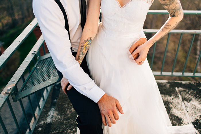 bride sitting on groom's lap