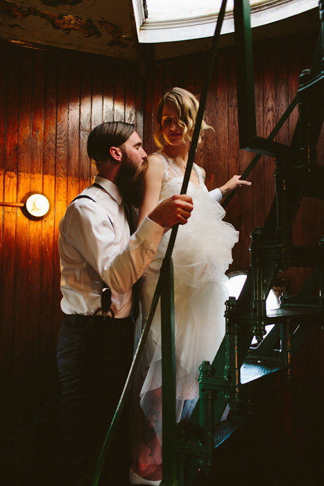 bride and groom climbing stairs