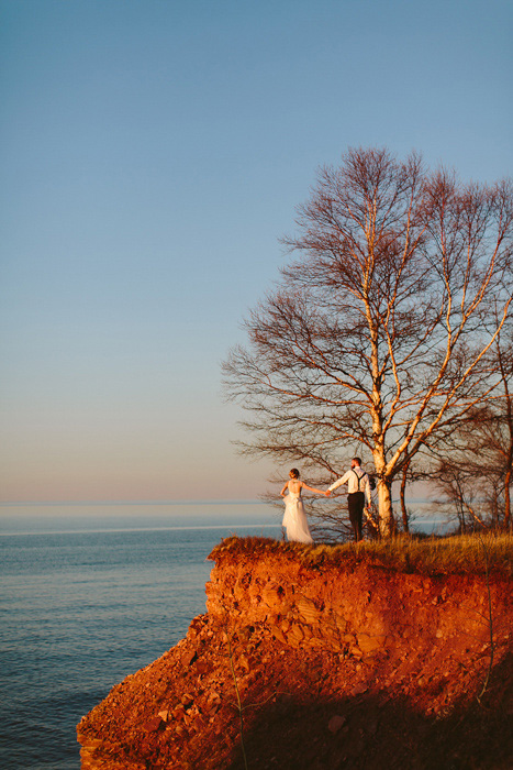 bride and groom on cliff