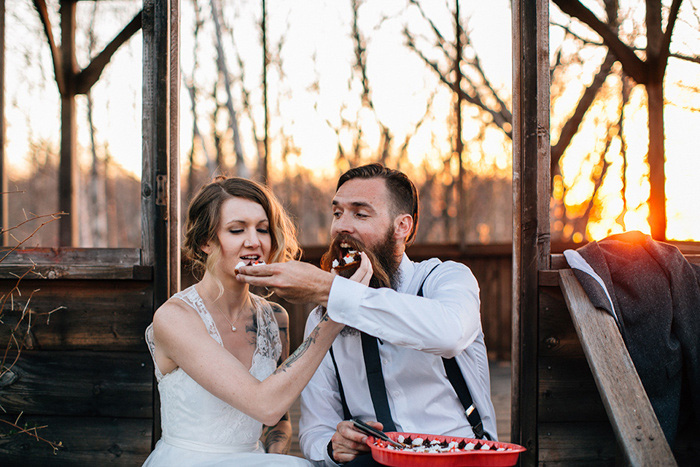 bride and groom eating cookie