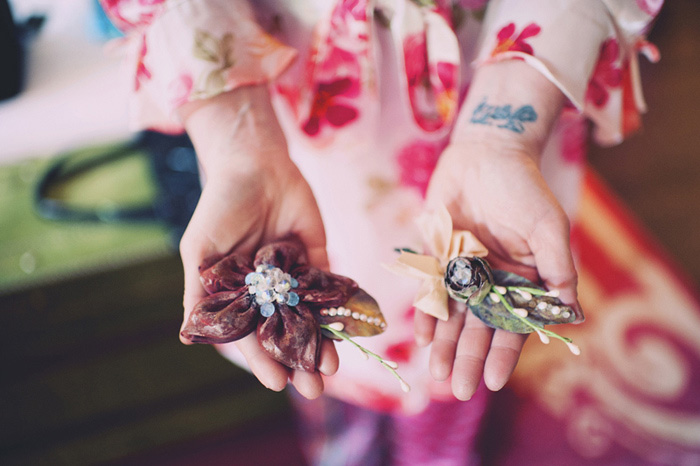 bride holding brooches