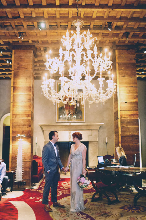 bride and groom in grand hotel lobby