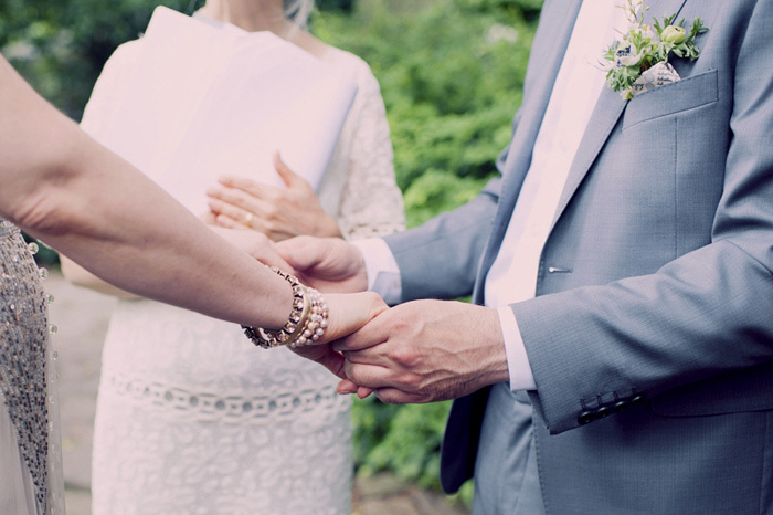 bride and groom holding hands