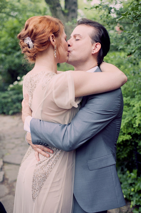 bride and groom first kiss