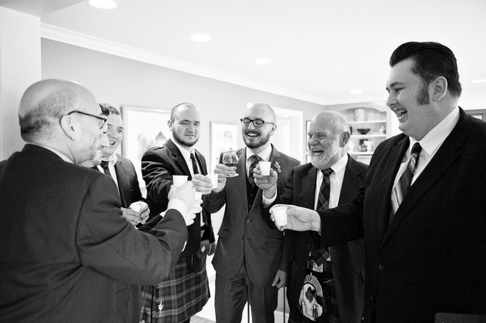 groom toasting with bridal party