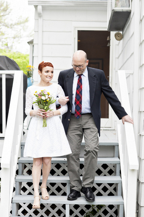 bride walking down steps with her father