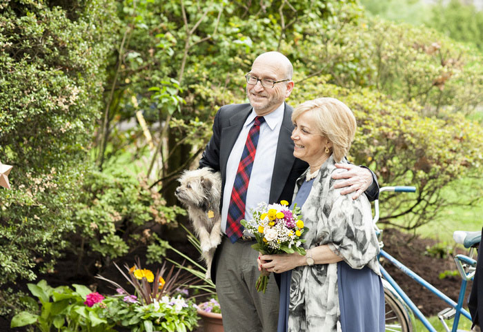 parents at backyard wedding ceremony