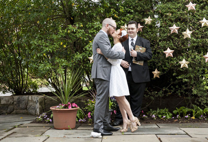 bride and groom first kiss