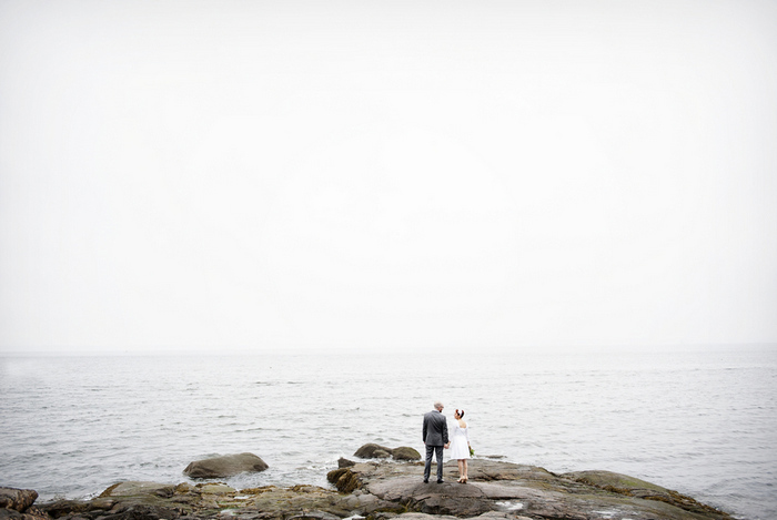 bride and groom by the water