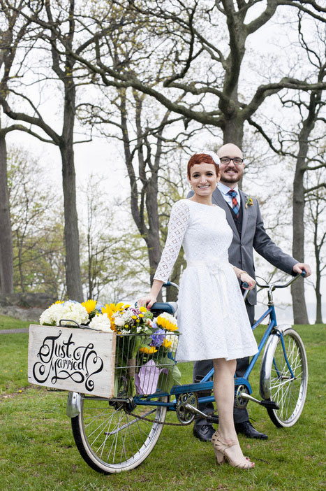 bride and groom with tandem bicycle