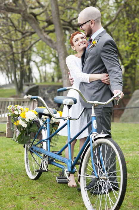 bride and groom with tandem bicycle