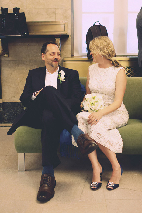 bride and groom waiting at city hall