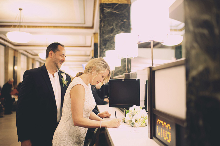 bride signing marriage licence