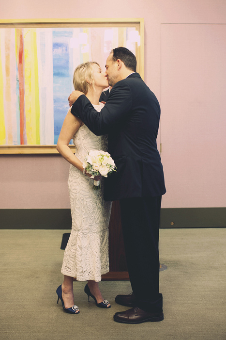 bride and groom first kiss