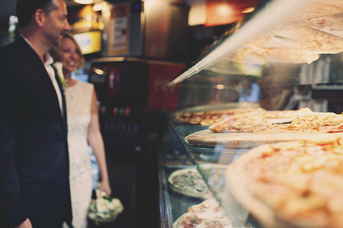 bride and groom in NYC pizzeria