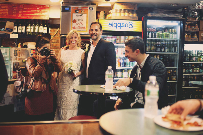 bride and groom in New York pizzeria