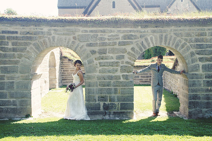 bride and groom portrait under archway