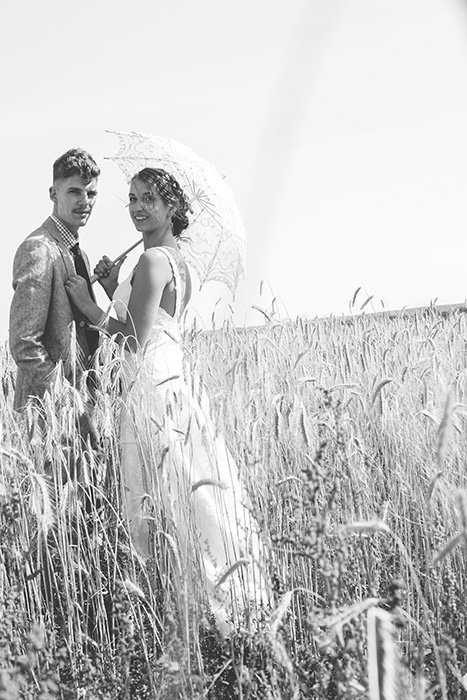 bride and groom in field