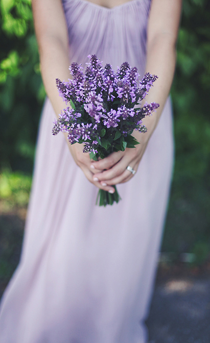 bridesmaid with lilac bouquet