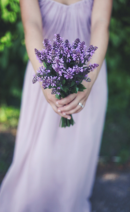 bridesmaid with lilac bouquet