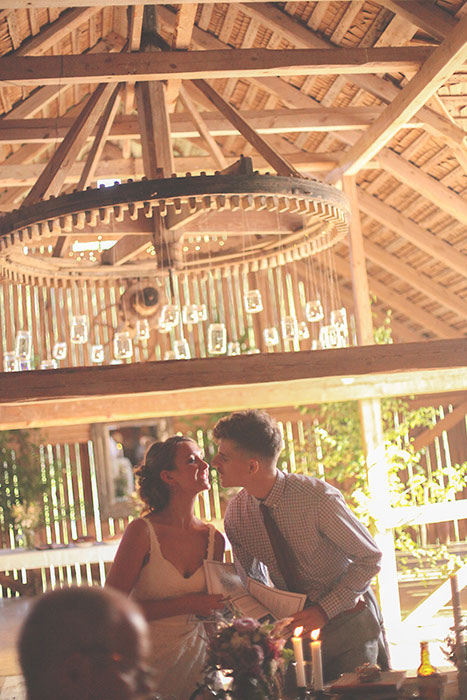 bride and groom at barn wedding reception