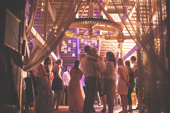 wedding guests dancing in barn