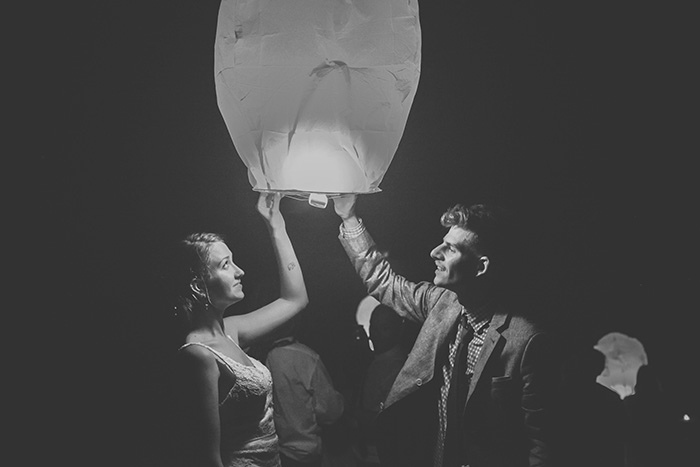 bride and groom releasing chinese wish lantern