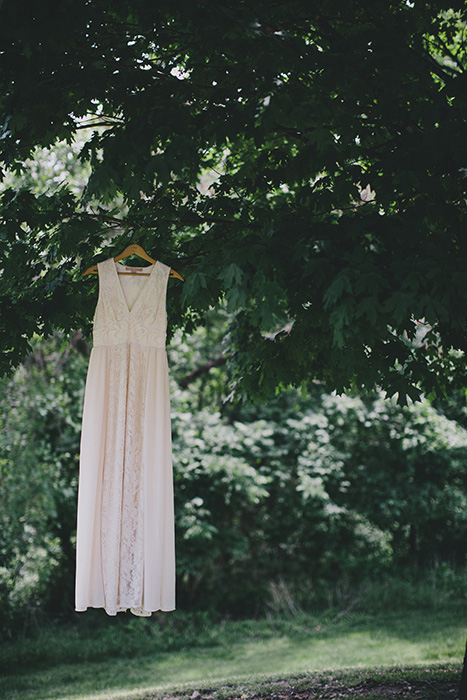 wedding dress hanging in tree