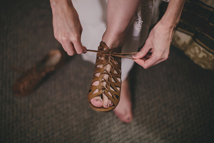 bride tying her shoes