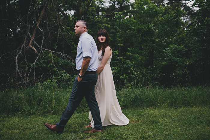 bride and groom walking in park