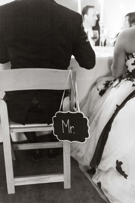 chalkboard Mr. wedding sign on back of chair