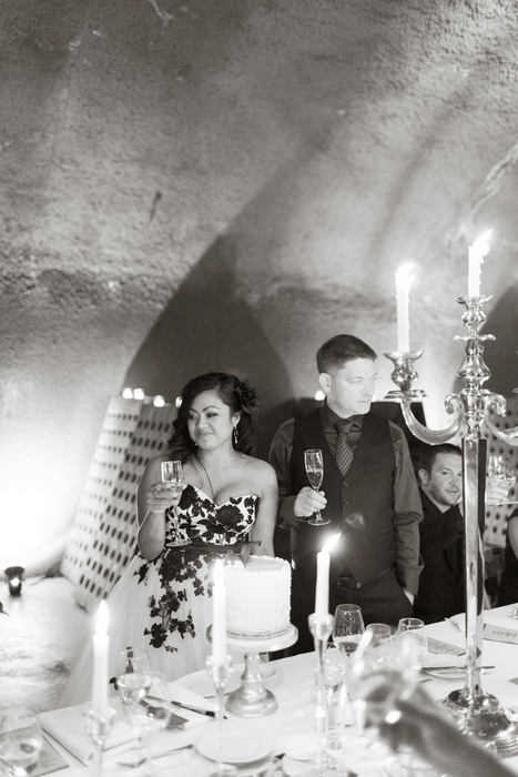 bride and groom with wedding cake