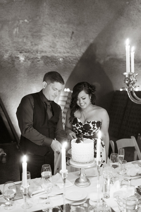 bride and groom cutting cake