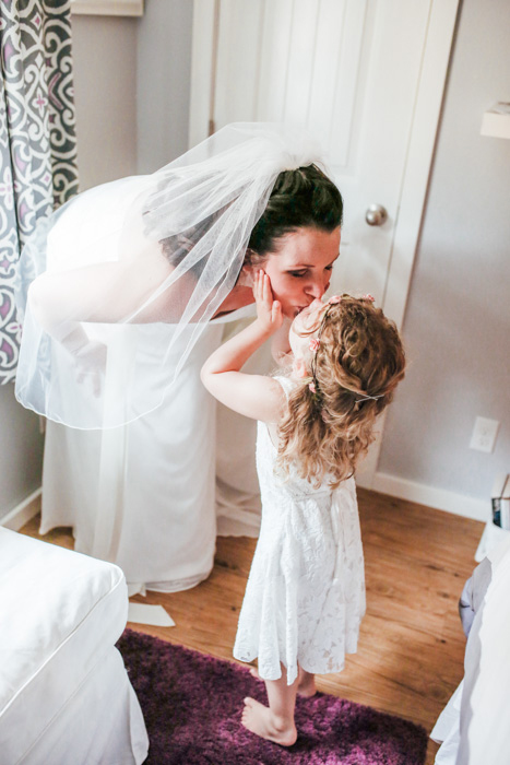 bride kissing her daughter