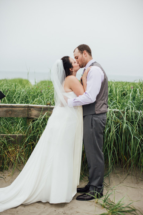 bride and groom first kiss