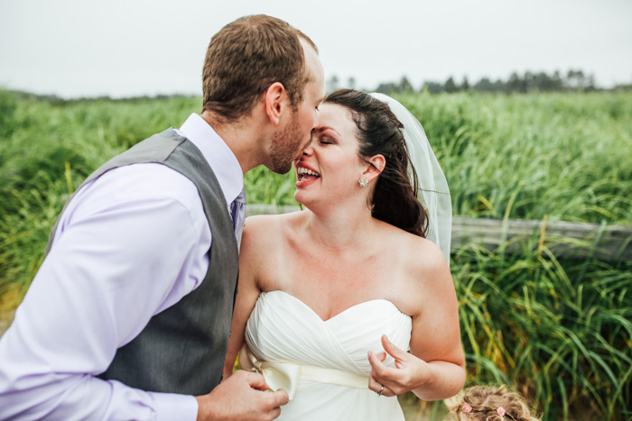 groom kissing bride on nose