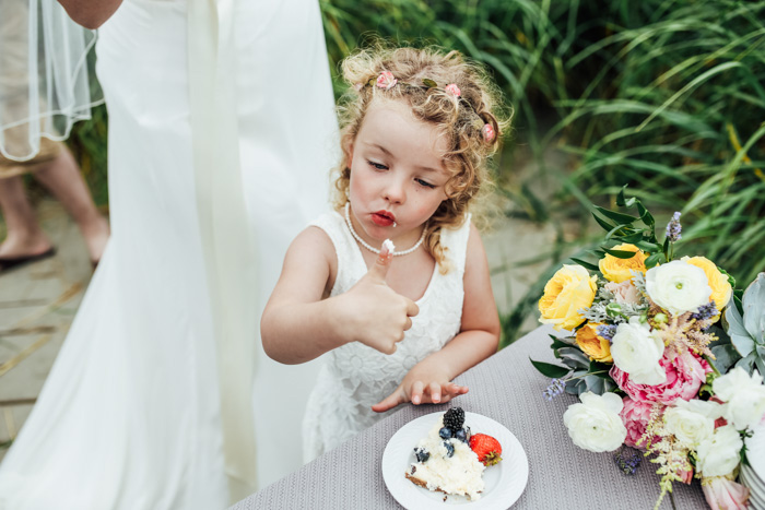 flower girl eating cake