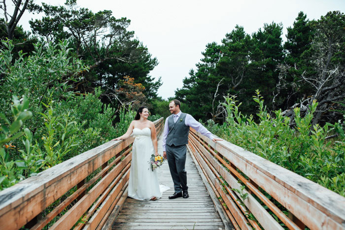 bride and groom on bridge