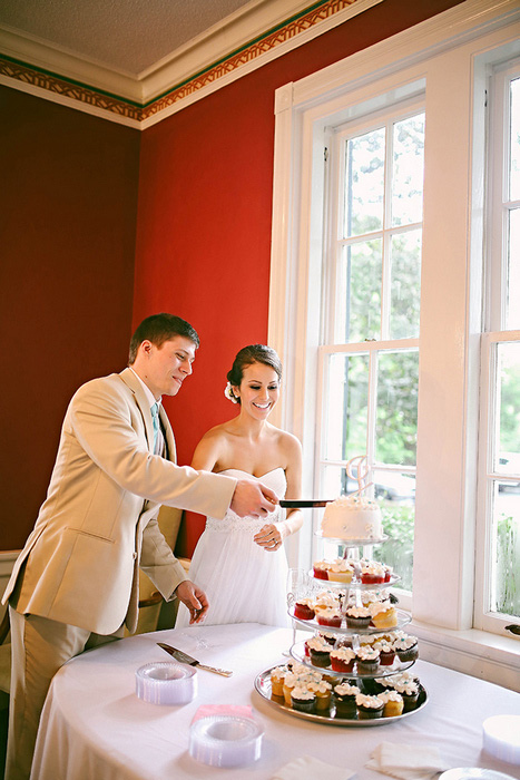 bride and groom cutting cake