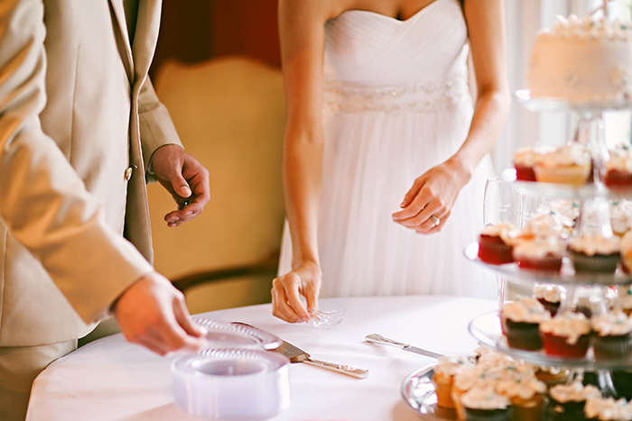 bride and groom getting ready to cut the cake