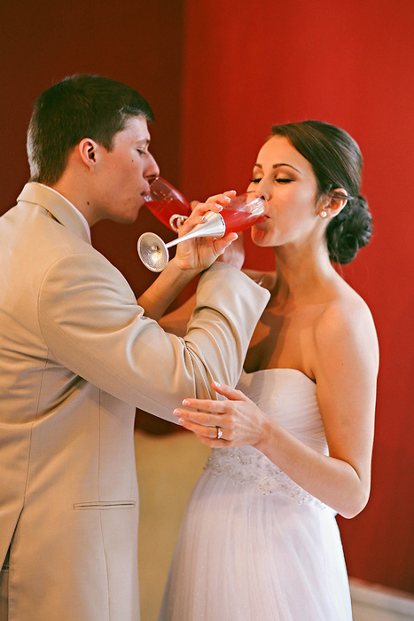 brid and groom drinking champagne