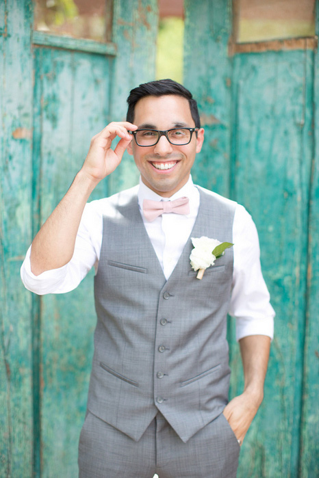 groom adjusting glasses