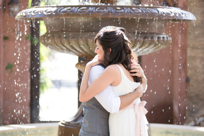 bride and groom hugging