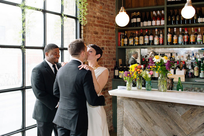 bride and groom first kiss