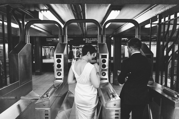 bride and groom entering subway