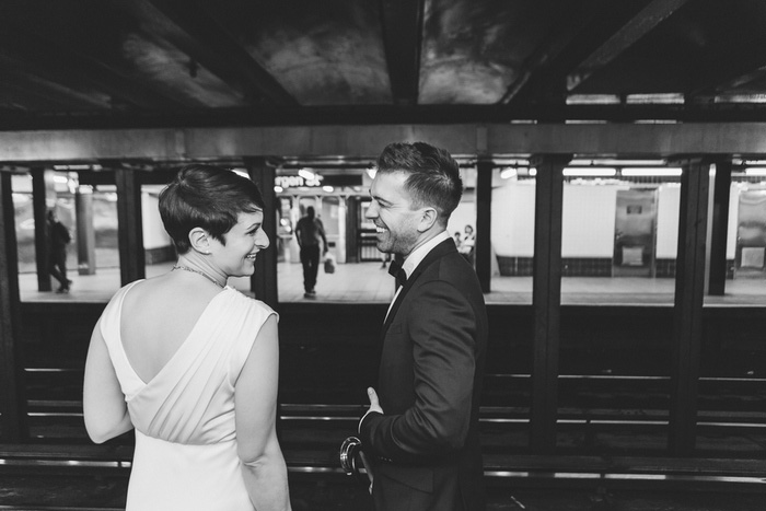 bride and groom on subway platform