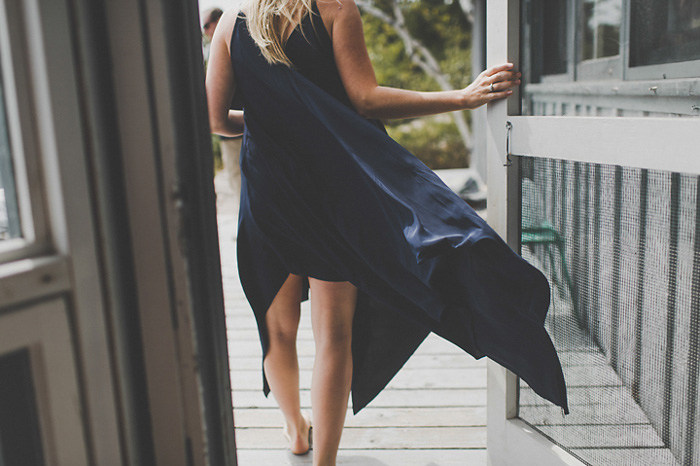 bride's blue dress blowing in the wind