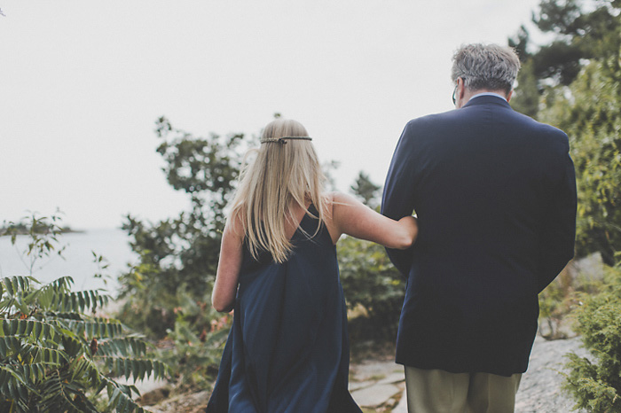 bride and father walking arm in arm