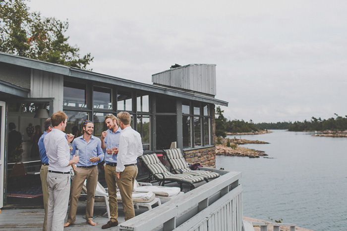 wedding guests on cottage deck